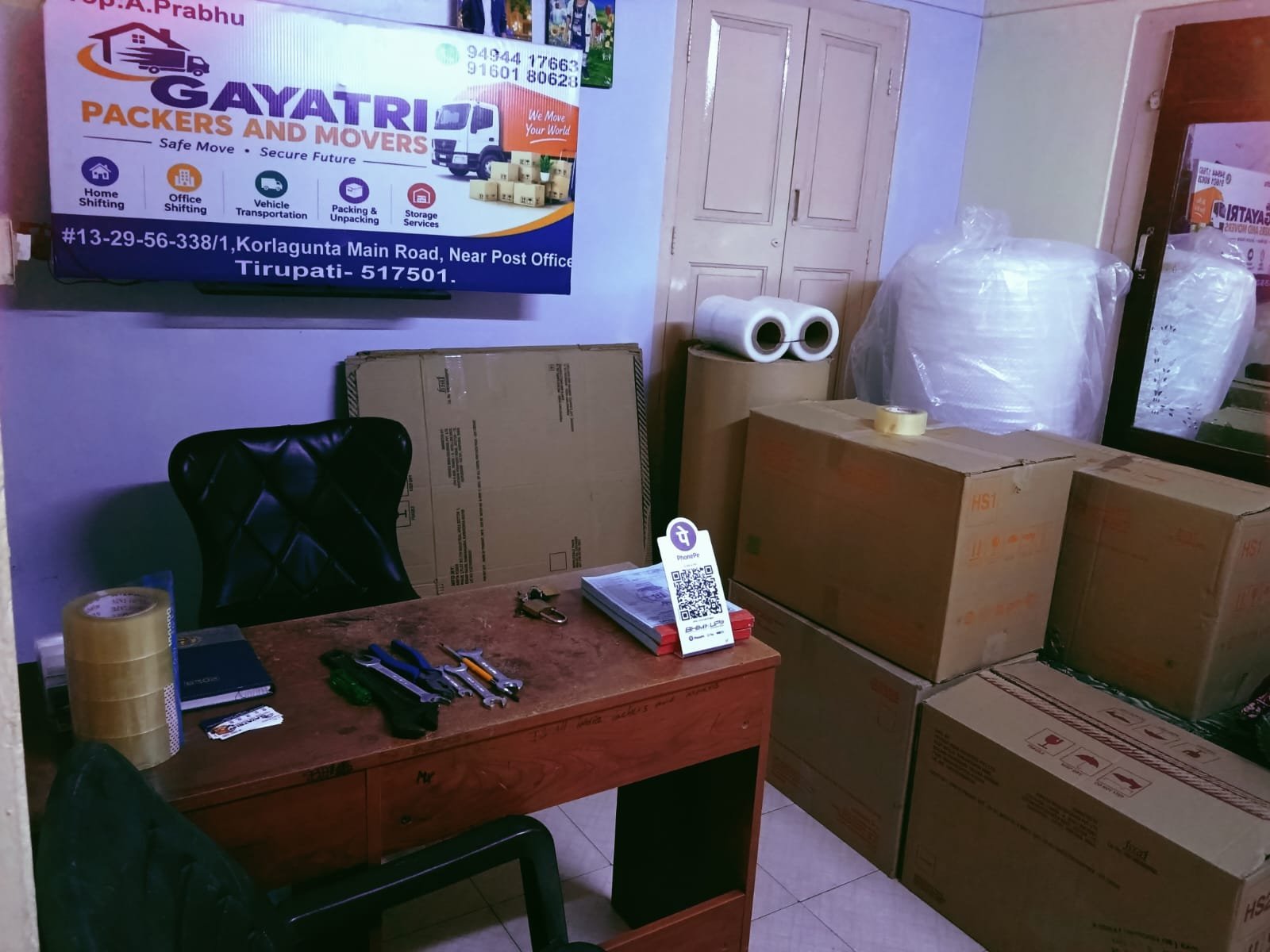 Gayatri Packers and Movers office with cartons and packing materials